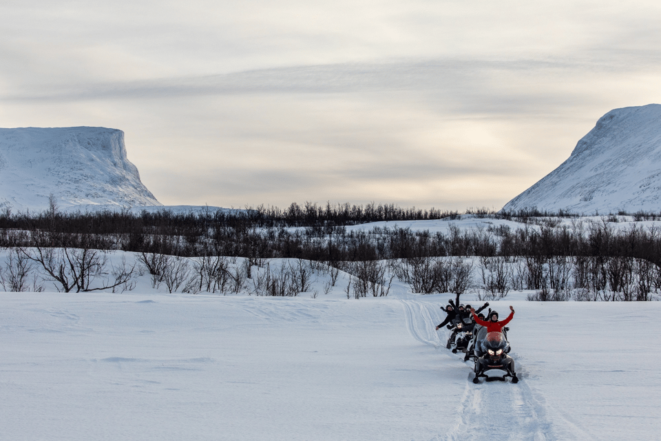 Abisko: Great Outback Snowmobile Tour with Lake Abiskojaure - Getting dressed in Arctic gear