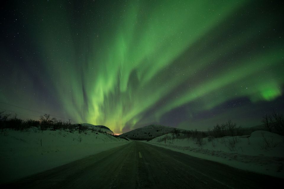 Abisko: Guided Aurora Chase with Hotel Transfers - A warm bus makes the stop-and-search format work