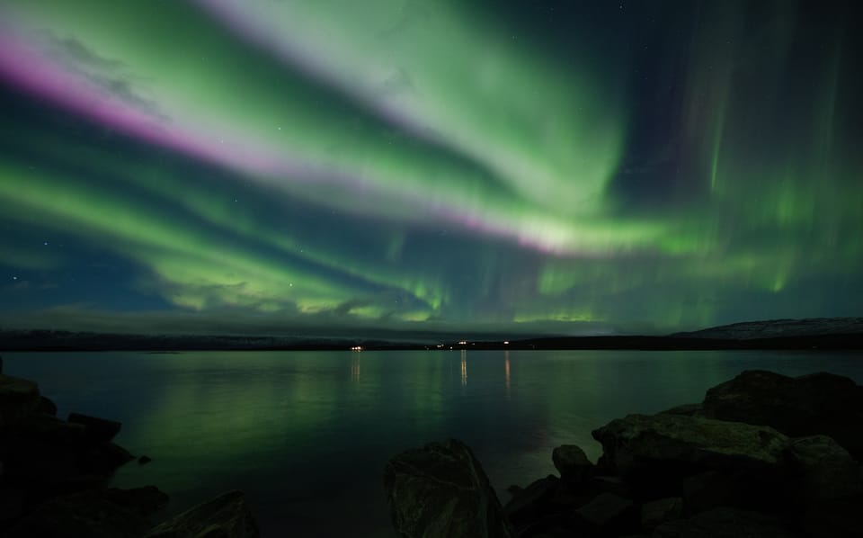 Abisko: Guided Autumn Aurora Chase with Hotel Transfers - Lake Torneträsk offers reflections and open views
