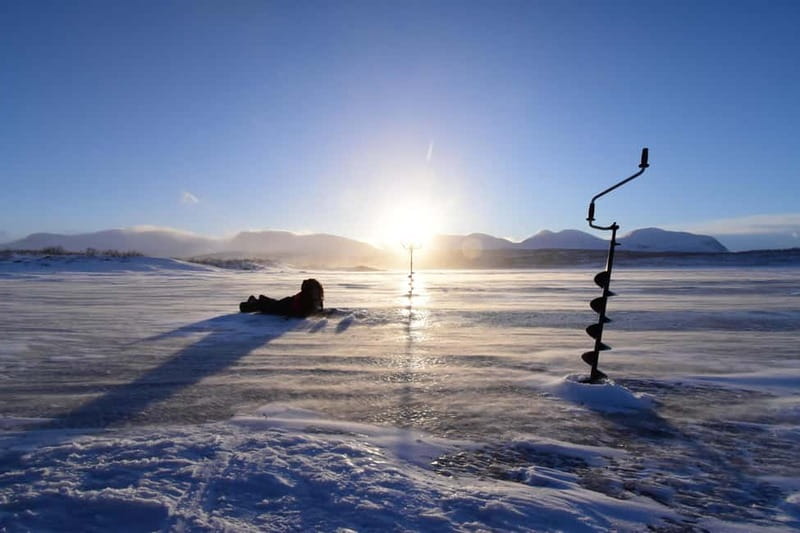 Abisko: Ice Fishing Experience - Drilling the ice and learning the equipment