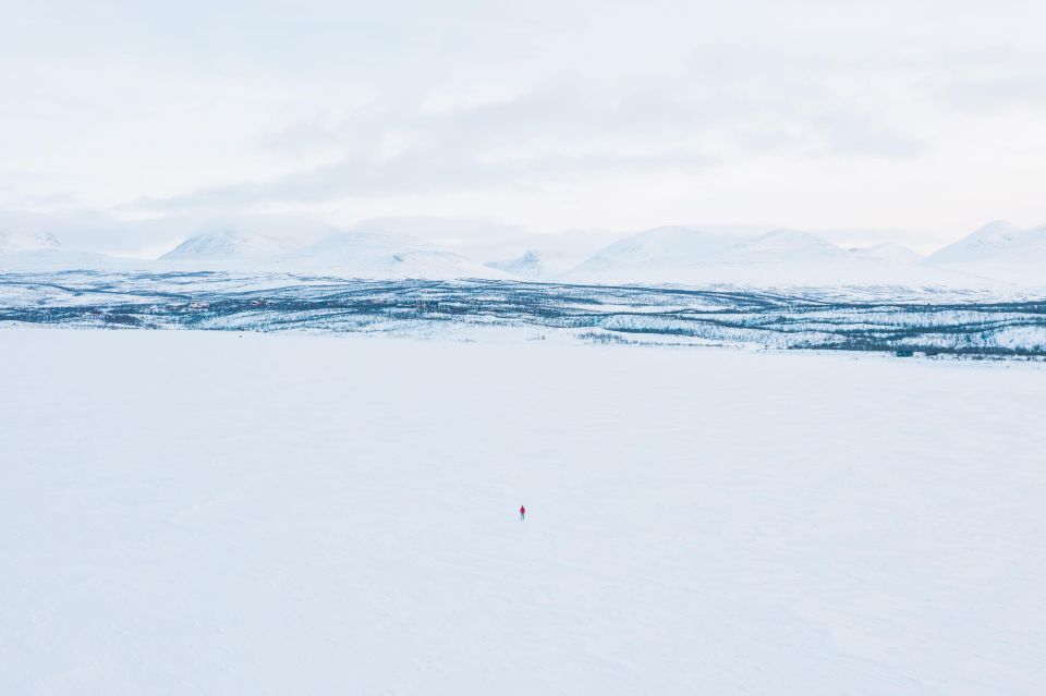 Abisko: Lake Torneträsk Arctic Ice Fishing Trip - Warm layers, boots, and the first look at the ice