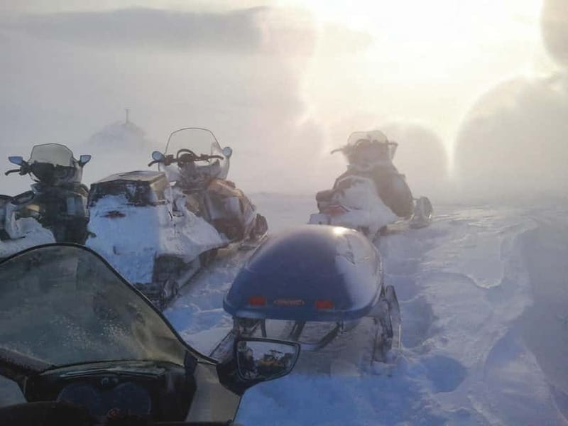 Aurora Hunt on Snowmobile - small groups - Fire, coffee, and Swedish fika
