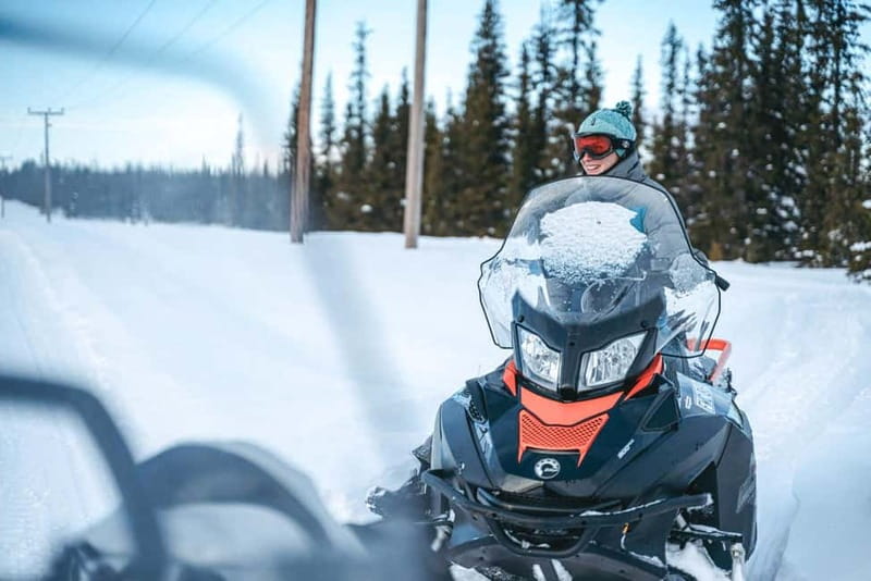 Aurora Hunt on Snowmobile - small groups - Getting dressed for a Kiruna night