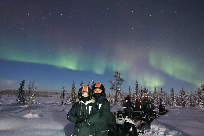 Snowmobile Aurora Expedition with dinner - Riding through forest, lake, and river country
