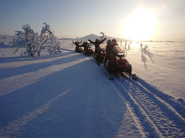 Snowmobile Safari to Lapland viewpoint - A frozen lake, coffee, and Swedish fika
