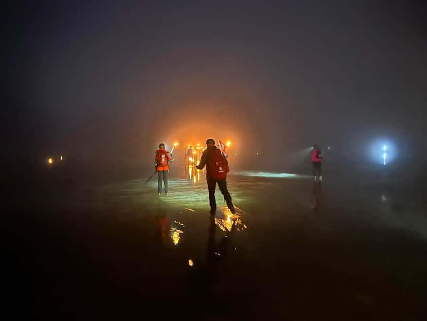 Stockholm: Ice Skating with fire & chance of Northern Lights - Following the torches across a frozen lake