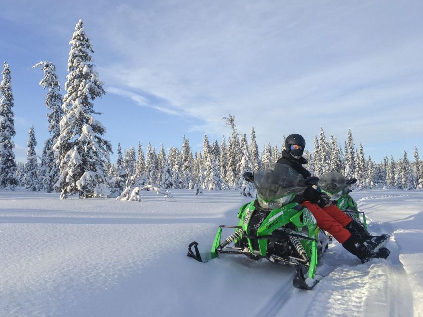 Wilderness Tour with Snowmobile & Ice Fishing - Riding across frozen lakes and snowy forests